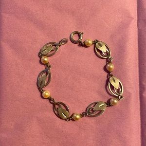 Silver tone metal and pearl bracelet